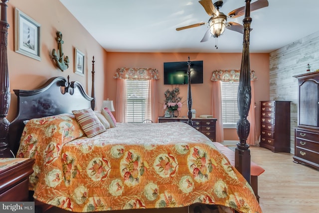 15149 Coultlands Reach, Milton, DE 19968 - bedroom with wood finished floors, an accent wall, and ceiling fan