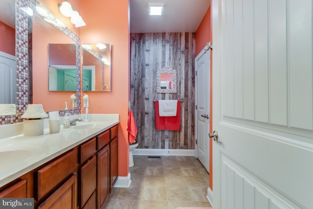 15149 Coultlands Reach, Milton, DE 19968 - full bathroom featuring baseboards, double vanity, and toilet