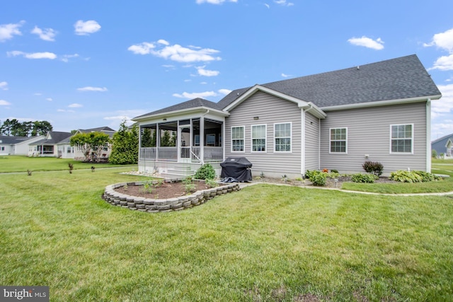 15149 Coultlands Reach, Milton, DE 19968 - back of house featuring a sunroom, a yard, and roof with shingles
