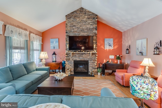 15149 Coultlands Reach, Milton, DE 19968 - living room with a stone fireplace, wood finished floors, and high vaulted ceiling