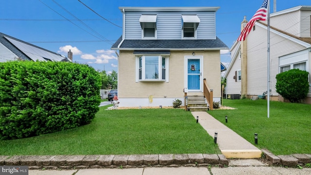 439 Hillcrest Ave, Glenolden, PA 19036 - view of front of property with entry steps, a shingled roof, a front yard, and stucco siding