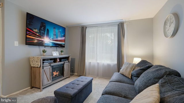 439 Hillcrest Ave, Glenolden, PA 19036 - living area with light carpet and a lit fireplace