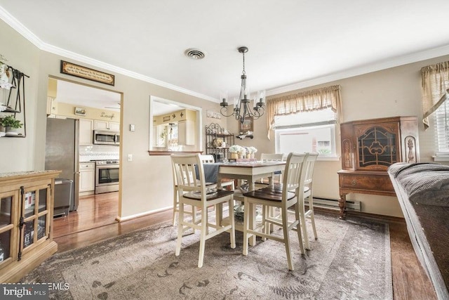 17 Drake St Unit 54A, Whiting, NJ 08759 - dining space featuring wood finished floors, a chandelier, ornamental molding, and a baseboard radiator