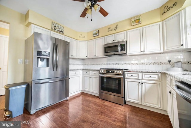 17 Drake St Unit 54A, Whiting, NJ 08759 - kitchen featuring appliances with stainless steel finishes, a ceiling fan, tasteful backsplash, dark wood-type flooring, and light stone countertops
