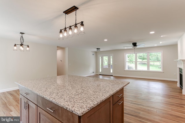 1406 Amosite Rd, Bainbridge, PA 17502 - kitchen featuring ceiling fan, light wood-style floors, hanging light fixtures, a center island, and recessed lighting