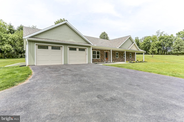 1406 Amosite Rd, Bainbridge, PA 17502 - single story home featuring asphalt driveway, a garage, board and batten siding, a front yard, and a porch