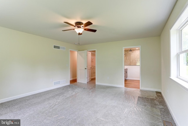1406 Amosite Rd, Bainbridge, PA 17502 - unfurnished bedroom featuring carpet, a spacious closet, multiple windows, and baseboards