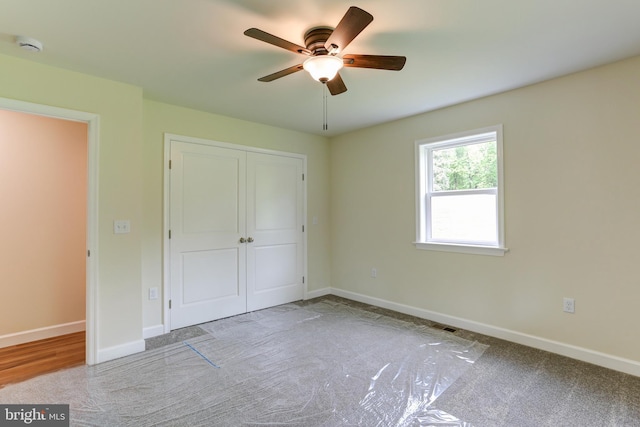 1406 Amosite Rd, Bainbridge, PA 17502 - unfurnished bedroom with carpet, baseboards, a closet, and ceiling fan