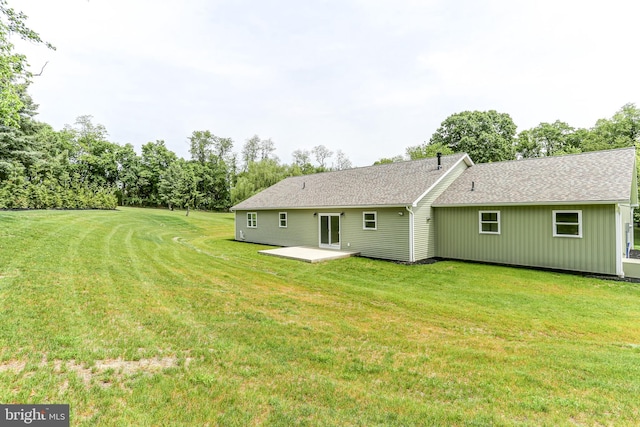 1406 Amosite Rd, Bainbridge, PA 17502 - back of house featuring a patio, a lawn, and roof with shingles