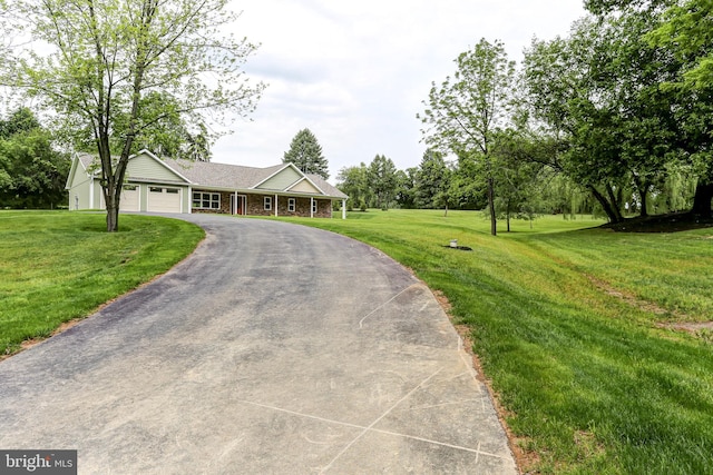 1406 Amosite Rd, Bainbridge, PA 17502 - ranch-style home featuring a garage, a front yard, and driveway