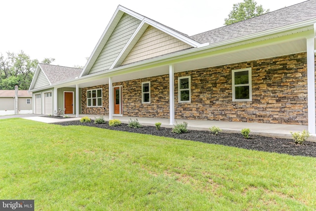 1406 Amosite Rd, Bainbridge, PA 17502 - view of front of property featuring a porch, stone siding, a garage, and a front lawn