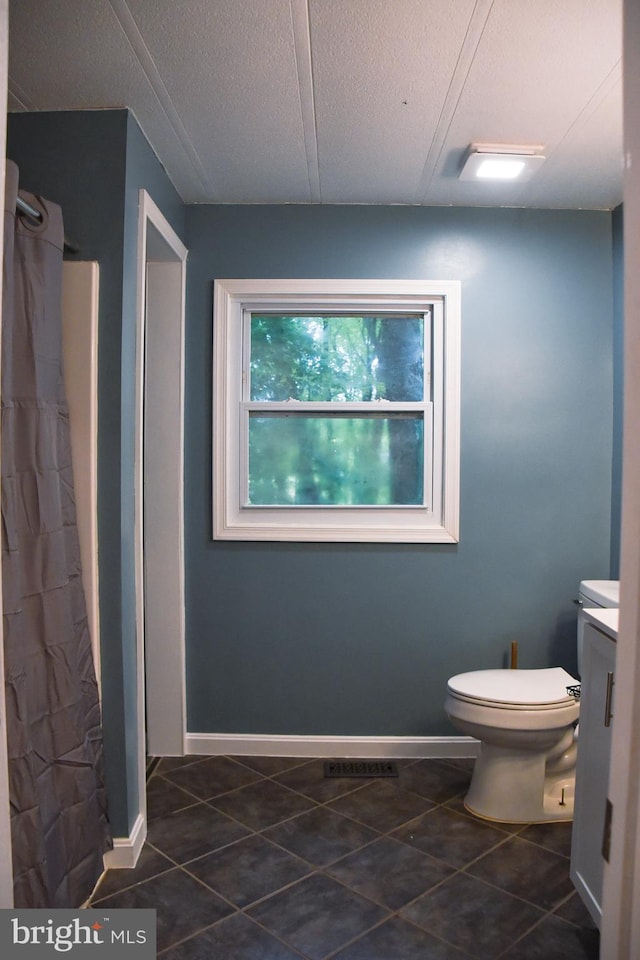 38 Behm Ln, Colora, MD 21917 - full bathroom with toilet, tile patterned floors, baseboards, and a textured ceiling