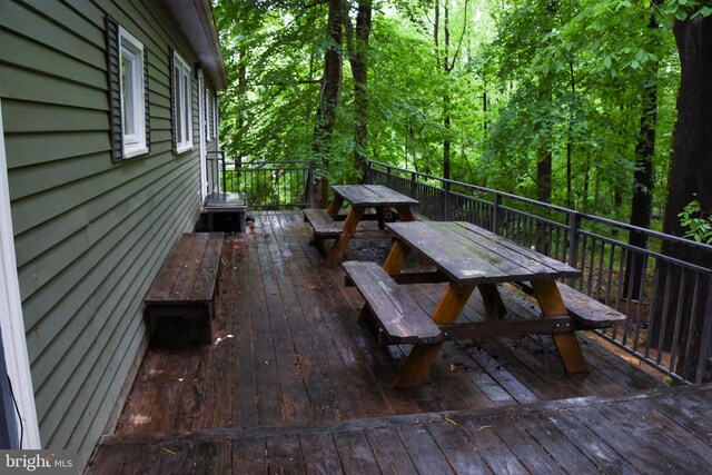 38 Behm Ln, Colora, MD 21917 - deck with outdoor dining space and a view of trees