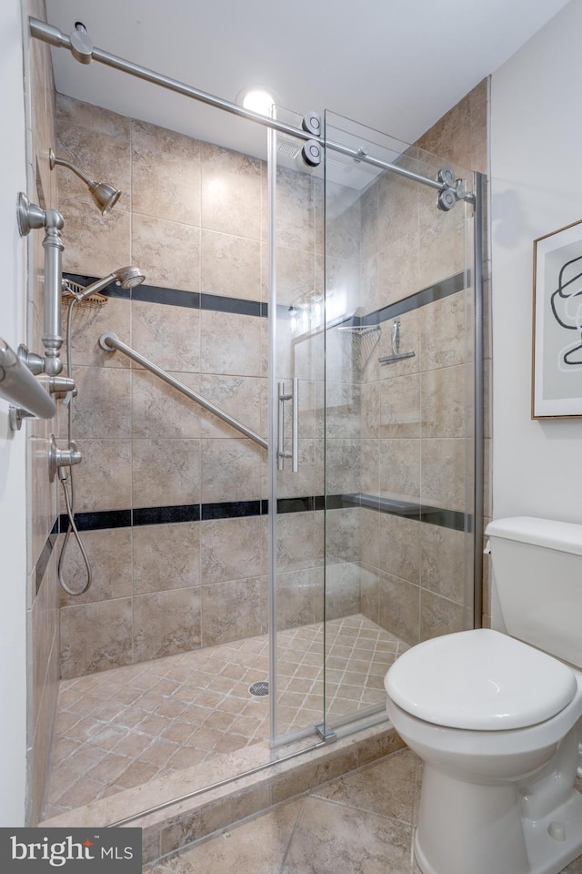 10518 Meadow Bridge Ln, Fairfax, VA 22030 - bathroom with toilet, a stall shower, and tile patterned flooring