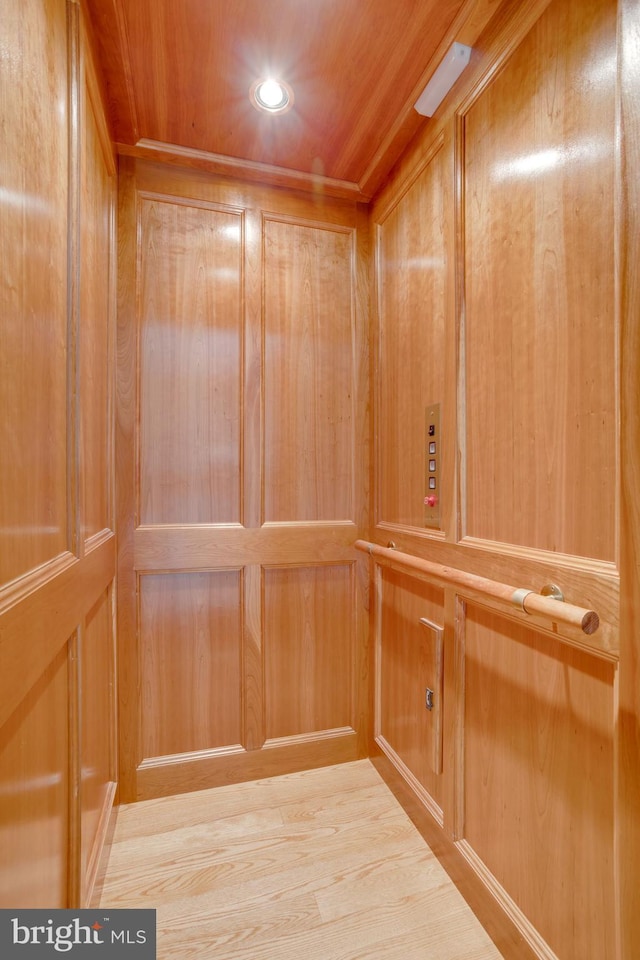 10518 Meadow Bridge Ln, Fairfax, VA 22030 - elevator with wooden ceiling, recessed lighting, and wood walls