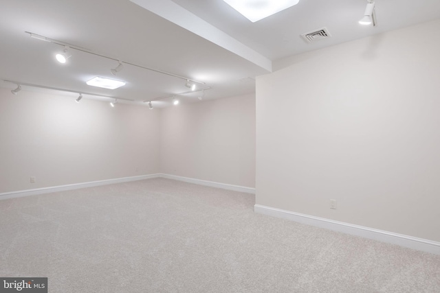 10518 Meadow Bridge Ln, Fairfax, VA 22030 - finished below grade area with rail lighting, light colored carpet, and baseboards