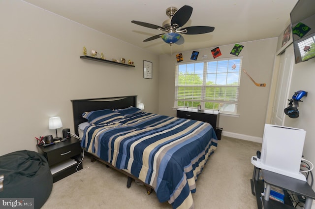 bedroom with carpet flooring, baseboards, and ceiling fan