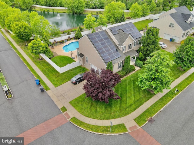 aerial view of a pool and a large body of water