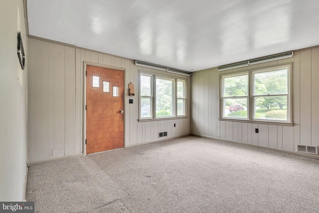view of carpeted entrance foyer