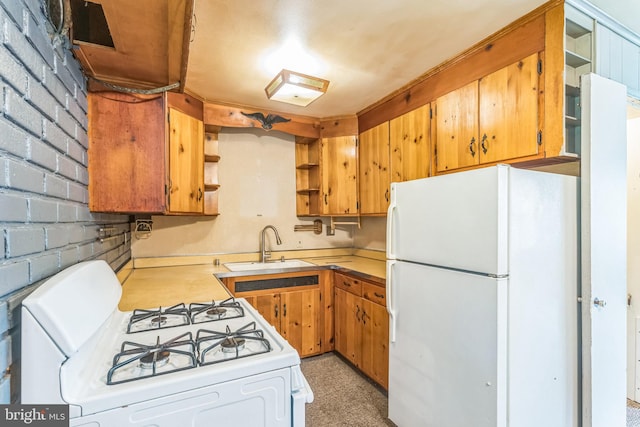 kitchen with white appliances, open shelves, light countertops, a sink, and brown cabinetry