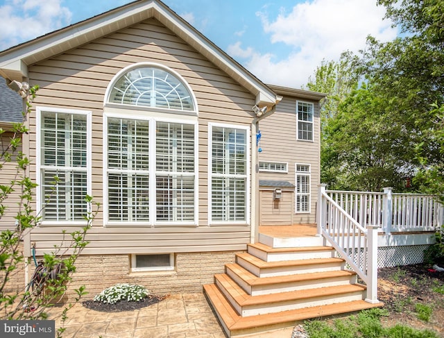 rear view of house with a deck