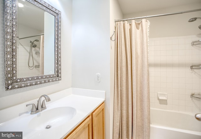 bathroom featuring vanity and shower / tub combo