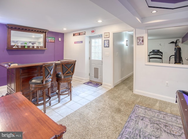 indoor dry bar featuring carpet flooring, recessed lighting, baseboards, and tile patterned flooring