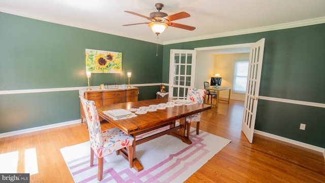 1042 Country Club Rd, Camp Hill, PA 17011 - dining space with french doors, light wood finished floors, ceiling fan, and crown molding