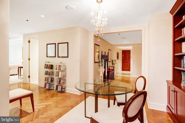 1155 23rd St NW Unit 2E, Washington, DC 20037 - dining area featuring a chandelier and baseboards