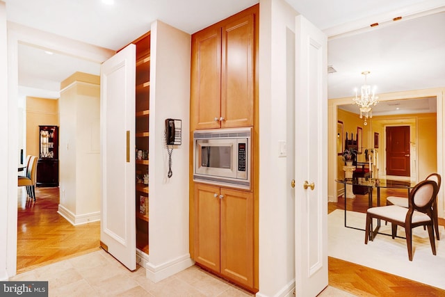 1155 23rd St NW Unit 2E, Washington, DC 20037 - corridor featuring a chandelier, baseboards, and recessed lighting