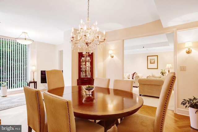 1155 23rd St NW Unit 2E, Washington, DC 20037 - dining area featuring a chandelier and baseboards