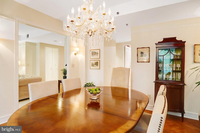 1155 23rd St NW Unit 2E, Washington, DC 20037 - dining space with a chandelier and baseboards