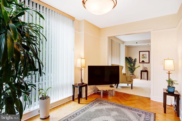 1155 23rd St NW Unit 2E, Washington, DC 20037 - living area featuring baseboards