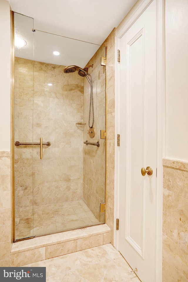 1155 23rd St NW Unit 2E, Washington, DC 20037 - full bath featuring a shower stall and tile walls