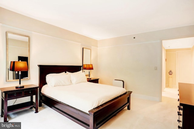 1155 23rd St NW Unit 2E, Washington, DC 20037 - bedroom featuring light carpet and baseboards