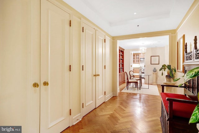 1155 23rd St NW Unit 2E, Washington, DC 20037 - corridor featuring a chandelier and a raised ceiling