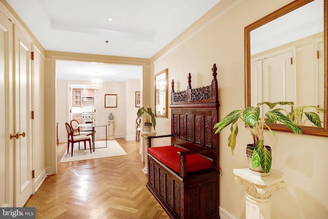 1155 23rd St NW Unit 2E, Washington, DC 20037 - corridor featuring a chandelier, a tray ceiling, baseboards, and recessed lighting