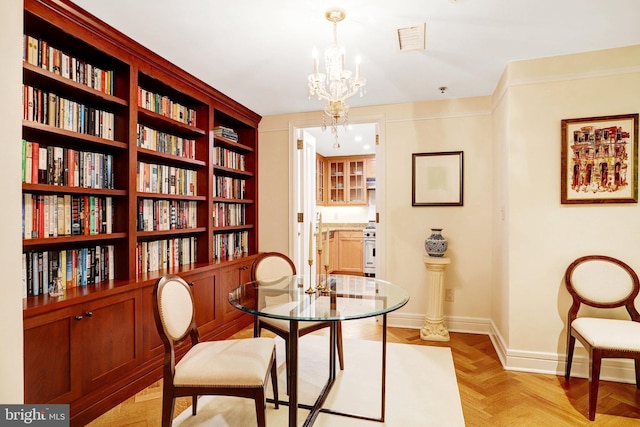 1155 23rd St NW Unit 2E, Washington, DC 20037 - dining area featuring baseboards and a chandelier