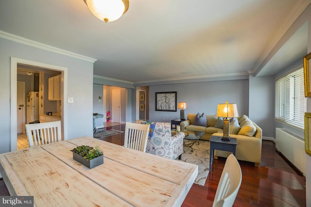 4201 Cathedral Ave NW Unit 916E, Washington, DC 20016 - dining room with crown molding, wood finished floors, and baseboards