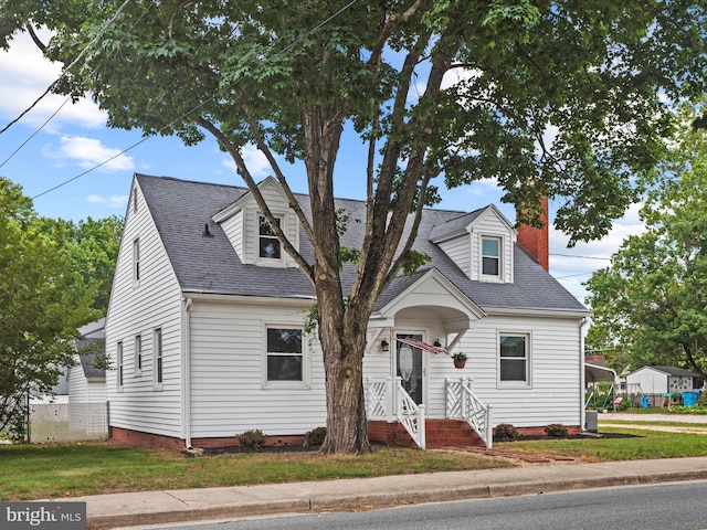 304 N Main St, Hebron, MD 21830 - new england style home with a chimney and roof with shingles