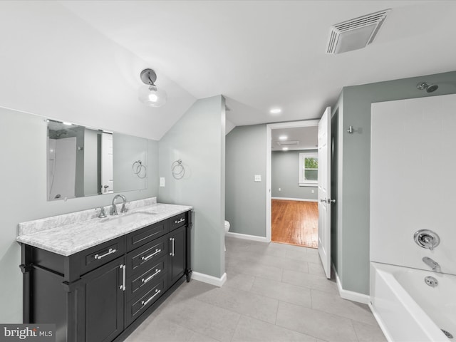 304 N Main St, Hebron, MD 21830 - bathroom featuring vanity, toilet, tile patterned flooring, shower / bath combination, and baseboards