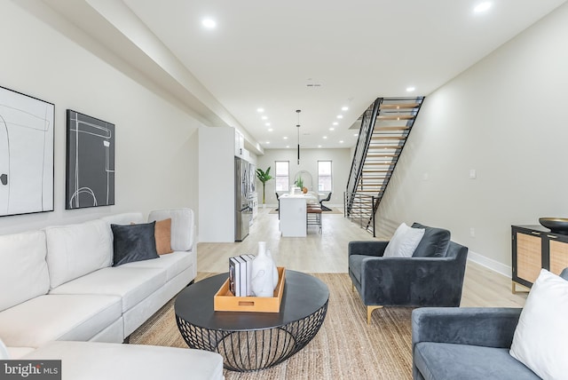 3231 Mercer St, Philadelphia, PA 19134 - living room featuring stairway, light wood finished floors, recessed lighting, and baseboards