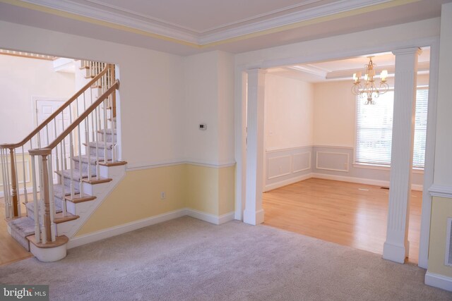 11504 Woodview Ct, Hagerstown, MD 21742 - spare room featuring decorative columns, crown molding, carpet, a chandelier, and stairway