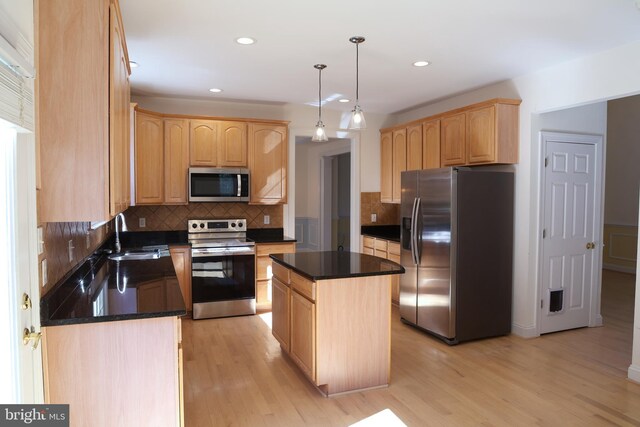 11504 Woodview Ct, Hagerstown, MD 21742 - kitchen with appliances with stainless steel finishes, light brown cabinetry, dark countertops, a sink, and recessed lighting