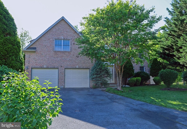 11504 Woodview Ct, Hagerstown, MD 21742 - view of front facade with brick siding, driveway, an attached garage, and a front yard