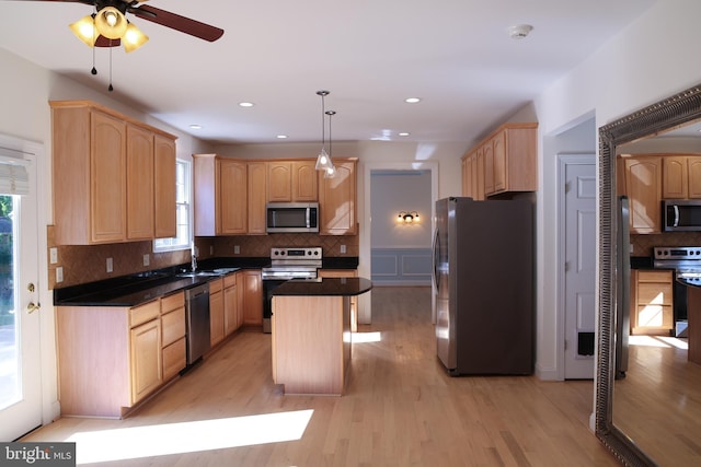 11504 Woodview Ct, Hagerstown, MD 21742 - kitchen with stainless steel appliances, light brown cabinets, a kitchen island, and recessed lighting