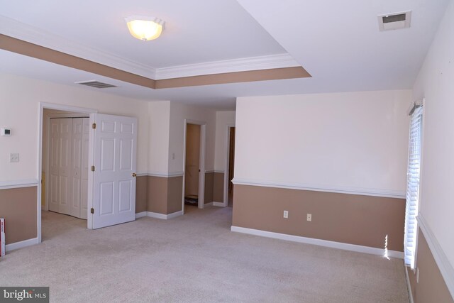 11504 Woodview Ct, Hagerstown, MD 21742 - unfurnished bedroom featuring ornamental molding, light carpet, baseboards, and a tray ceiling