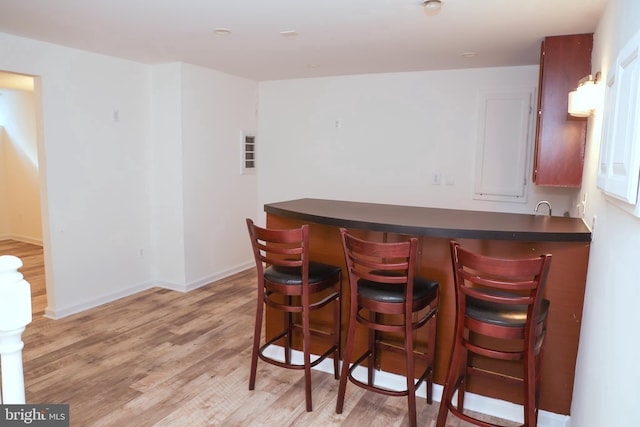 11504 Woodview Ct, Hagerstown, MD 21742 - indoor bar featuring light wood-style flooring and baseboards