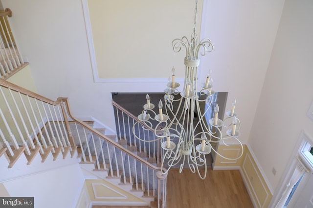 11504 Woodview Ct, Hagerstown, MD 21742 - stairs featuring a chandelier and wood finished floors
