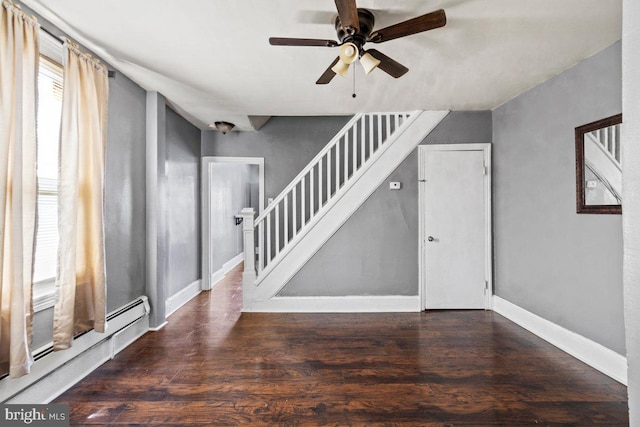 636 Elizabeth St, Beverly, NJ 08010 - unfurnished living room featuring stairs, ceiling fan, baseboards, wood finished floors, and a baseboard heating unit